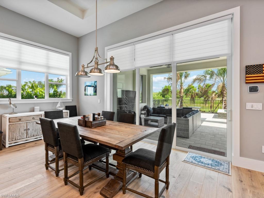 Dining room with light hardwood / wood-style flooring