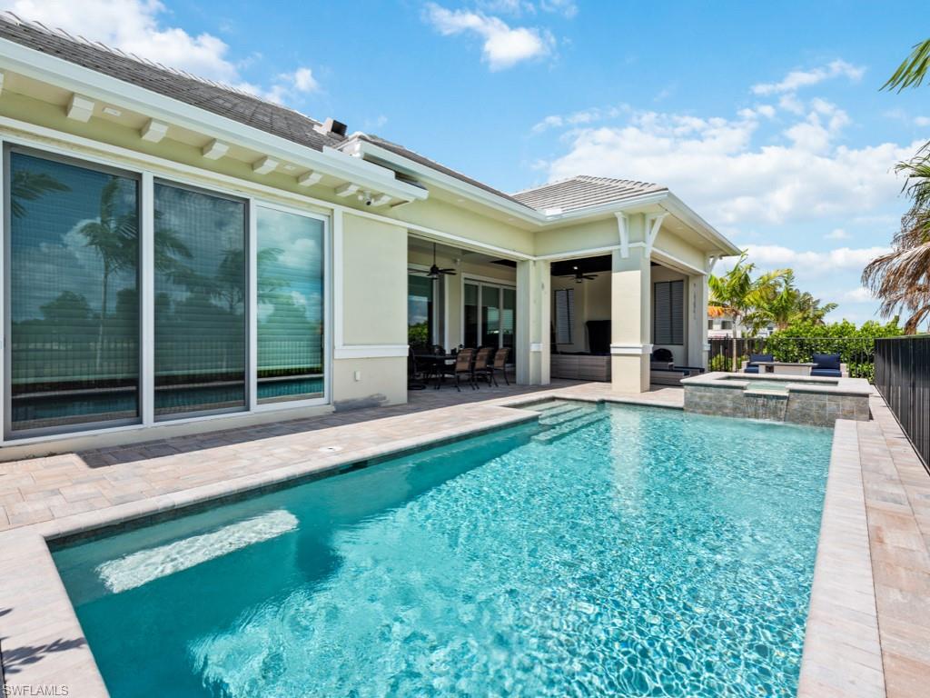 View of swimming pool with a patio