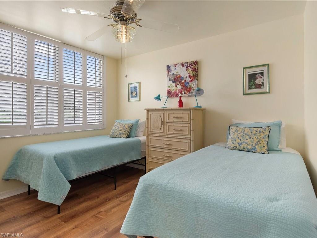 Bedroom with wood finished floors and ceiling fan