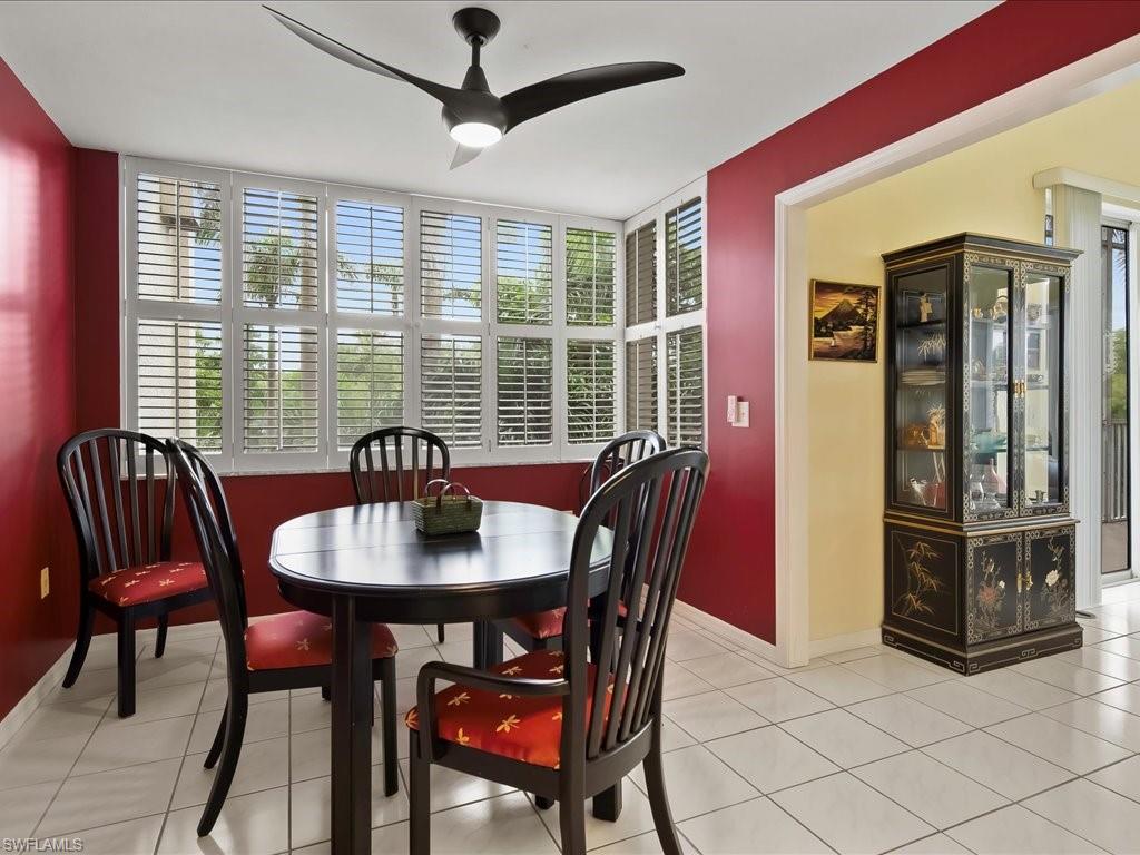 Dining area featuring light tile patterned floors and ceiling fan