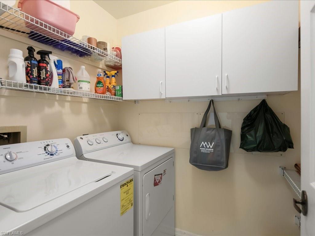 Laundry room with independent washer and dryer and cabinet space