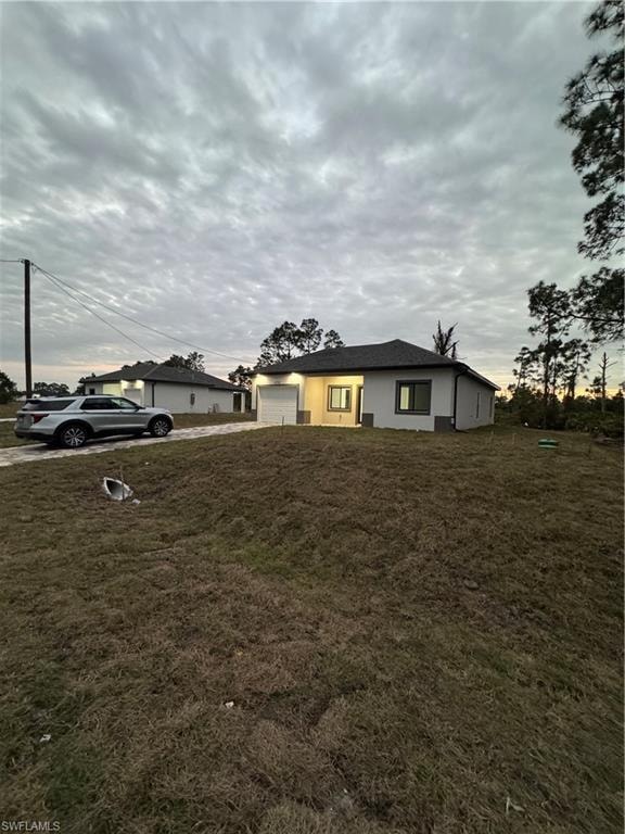 View of yard with a garage