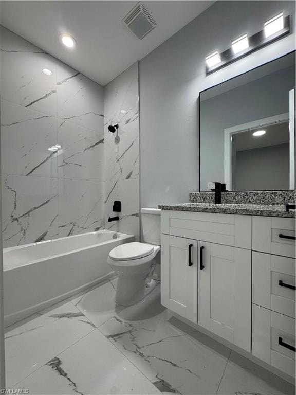Full bathroom featuring toilet, tiled shower / bath, and vanity
