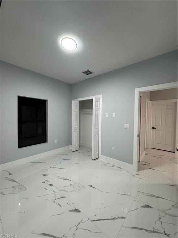 Unfurnished bedroom with a closet