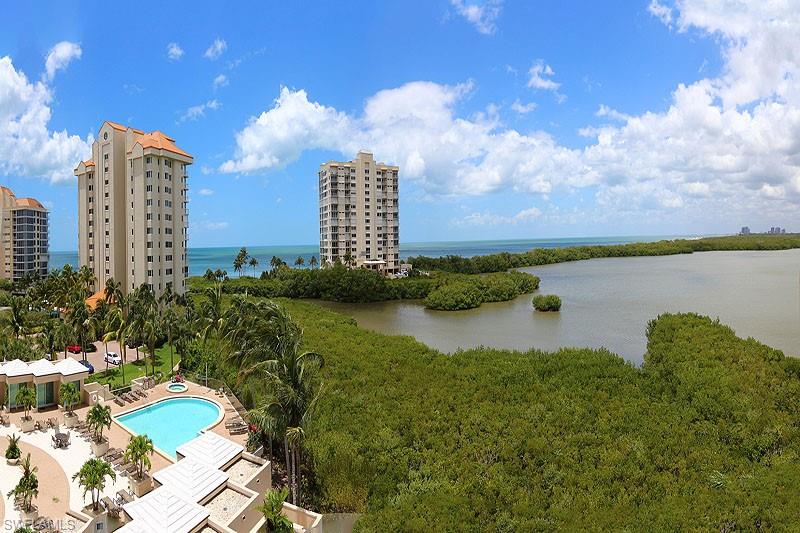 Expansive water frontage featuring lush green foliage and open water