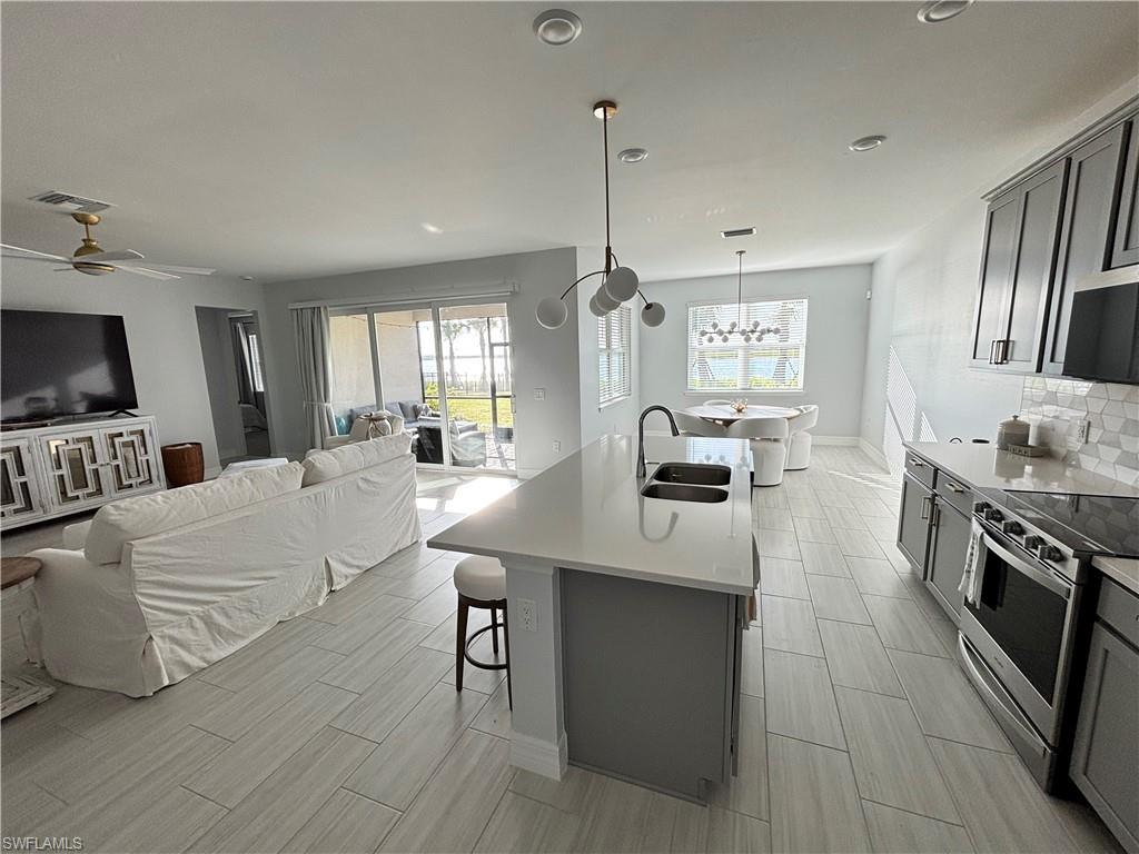 Great Room opens to kitchen, living and dining room