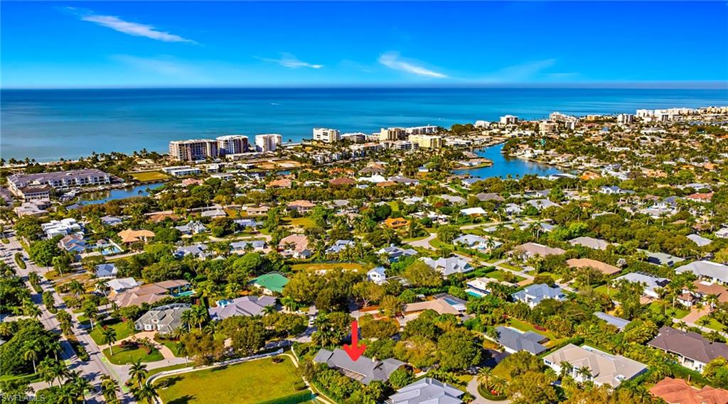 View of property location with a large body of water and nearby suburban area
