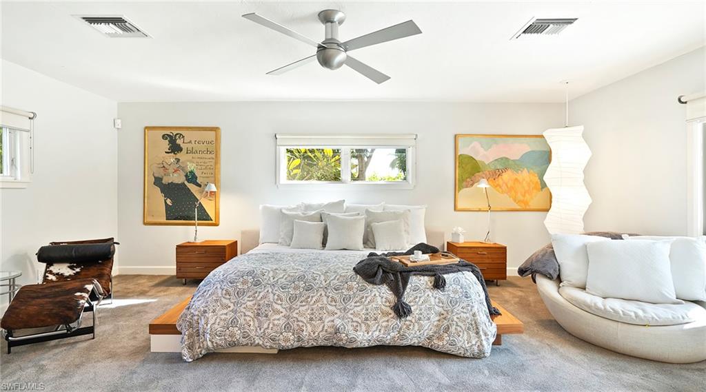 Carpeted bedroom with ceiling fan