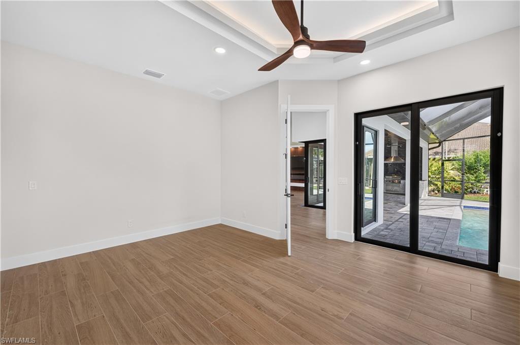 Tray ceiling with recessed lighting and a ceiling fan
