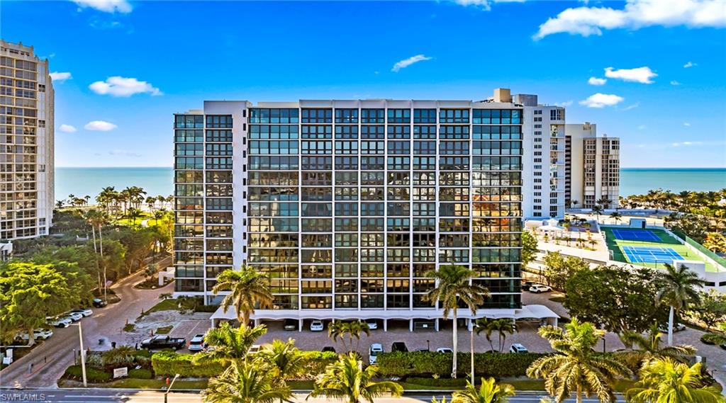 View of apartment building / complex with a water view