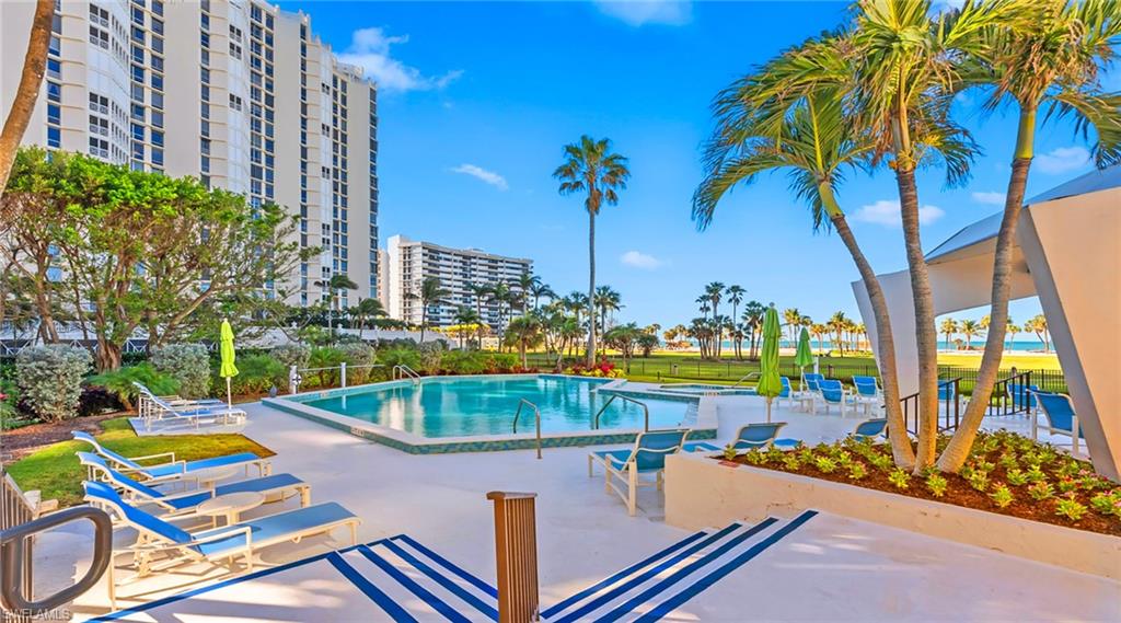 Community pool with a patio area