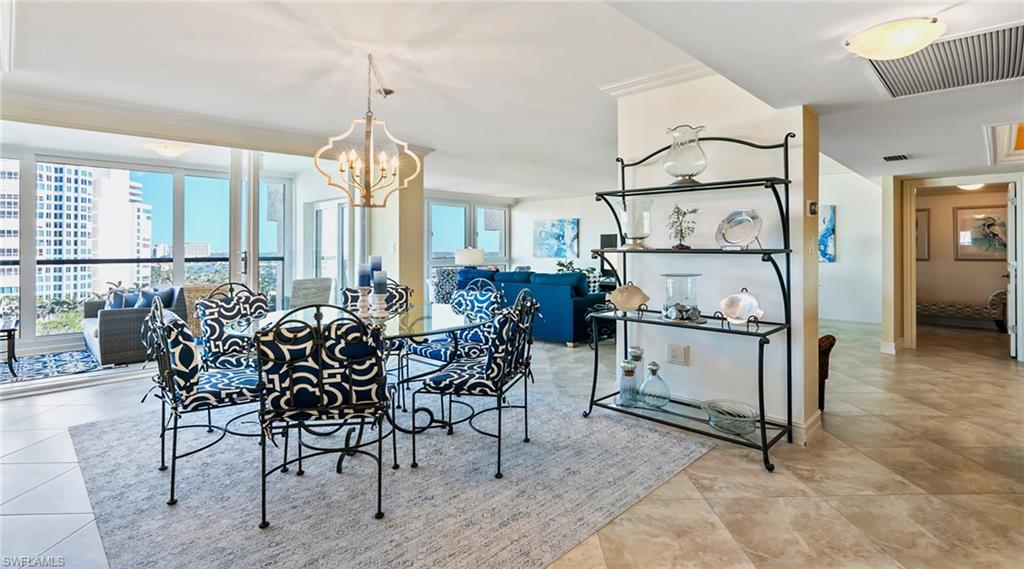 Dining room featuring a chandelier and light tile patterned flooring