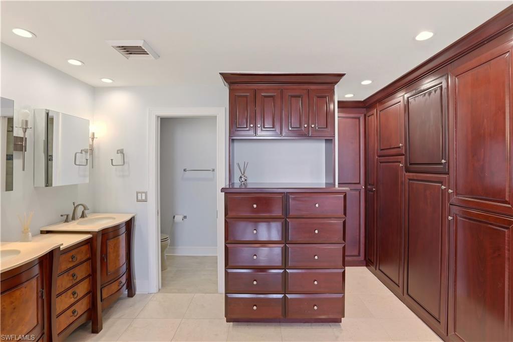 Primary suite with dual sinks and custom cabinetry
