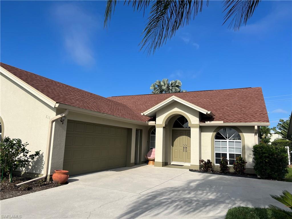 Single story home featuring a garage