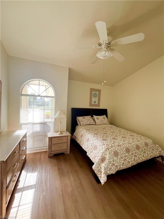 Bedroom with ceiling fan and wood-type flooring