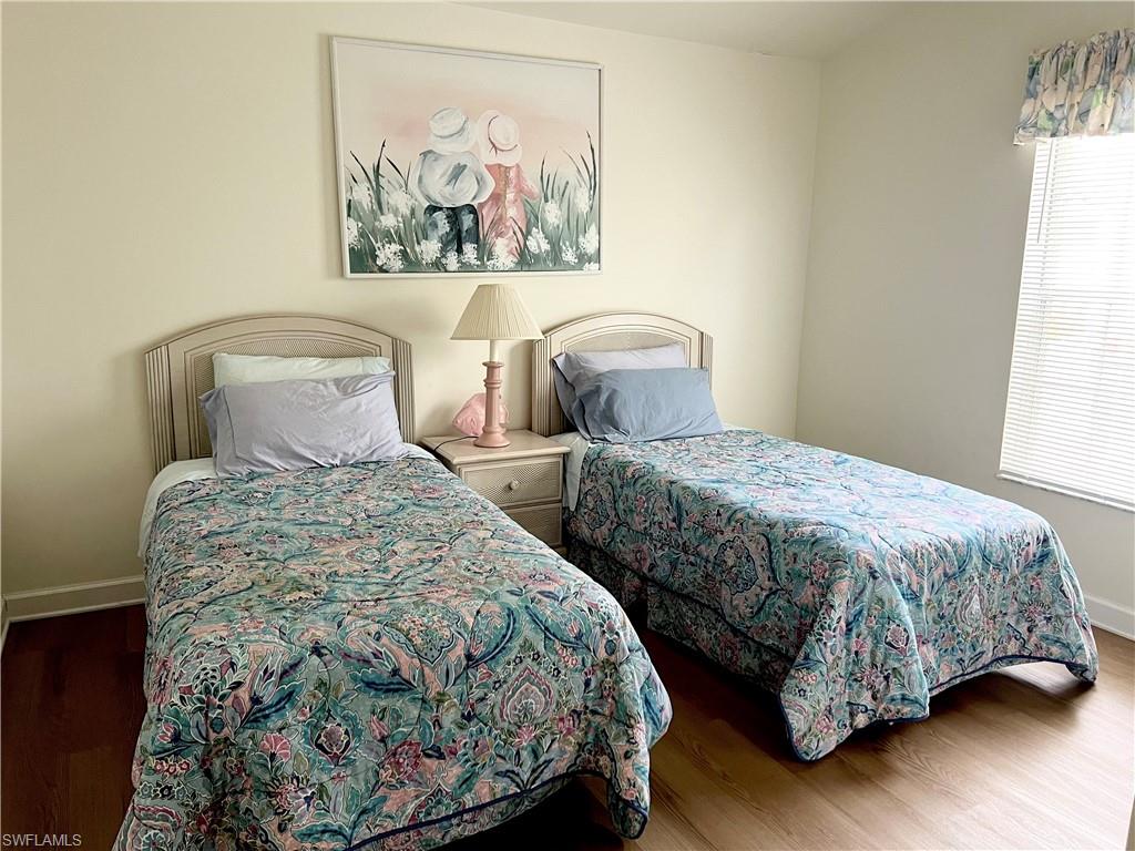 Bedroom featuring dark hardwood / wood-style floors