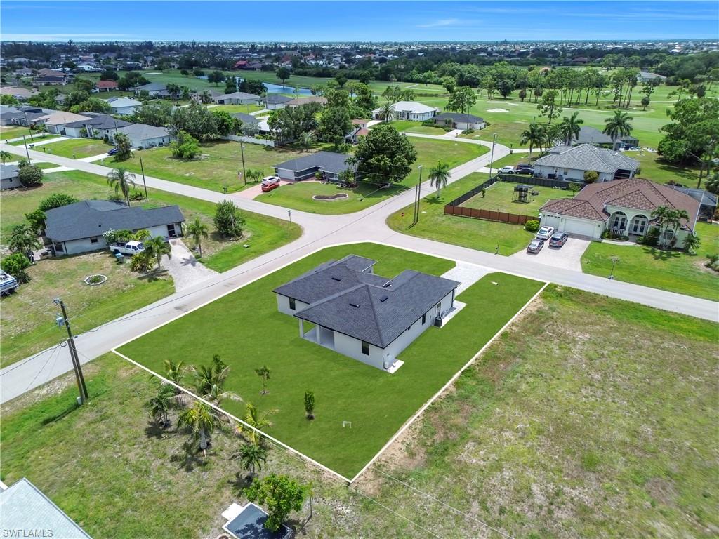 Aerial perspective highlighting a newly constructed residence on a corner lot