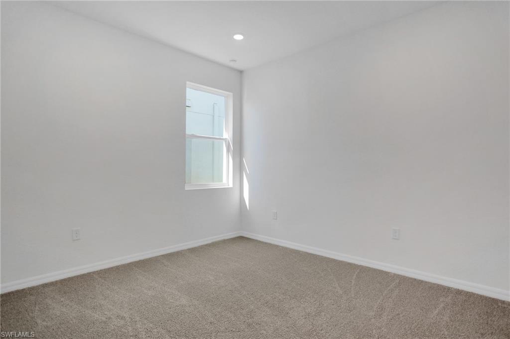 Unfurnished room with carpet floors and recessed lighting