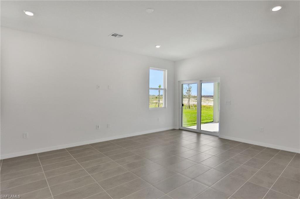 Spare room with recessed lighting and light tile patterned floors
