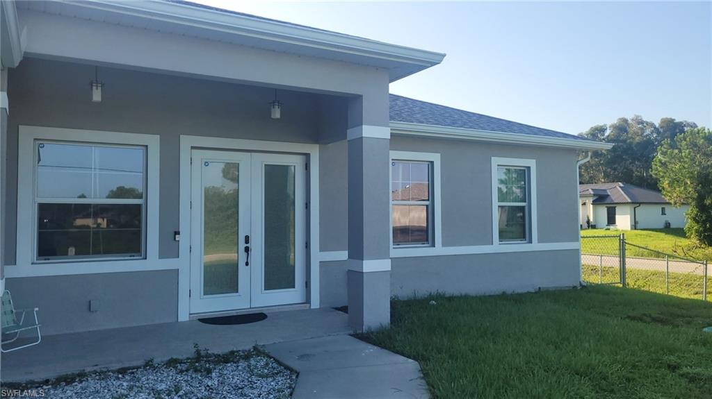 Grey exterior with white trim accents and a covered front porch
