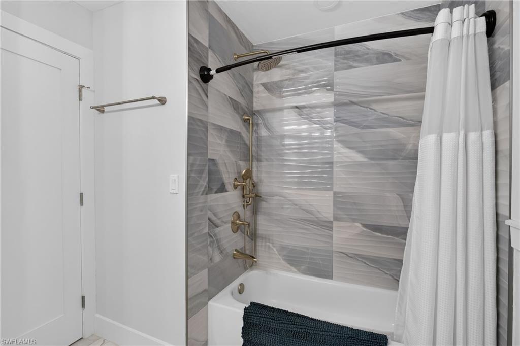 Multiple shower heads, tub/shower combination.