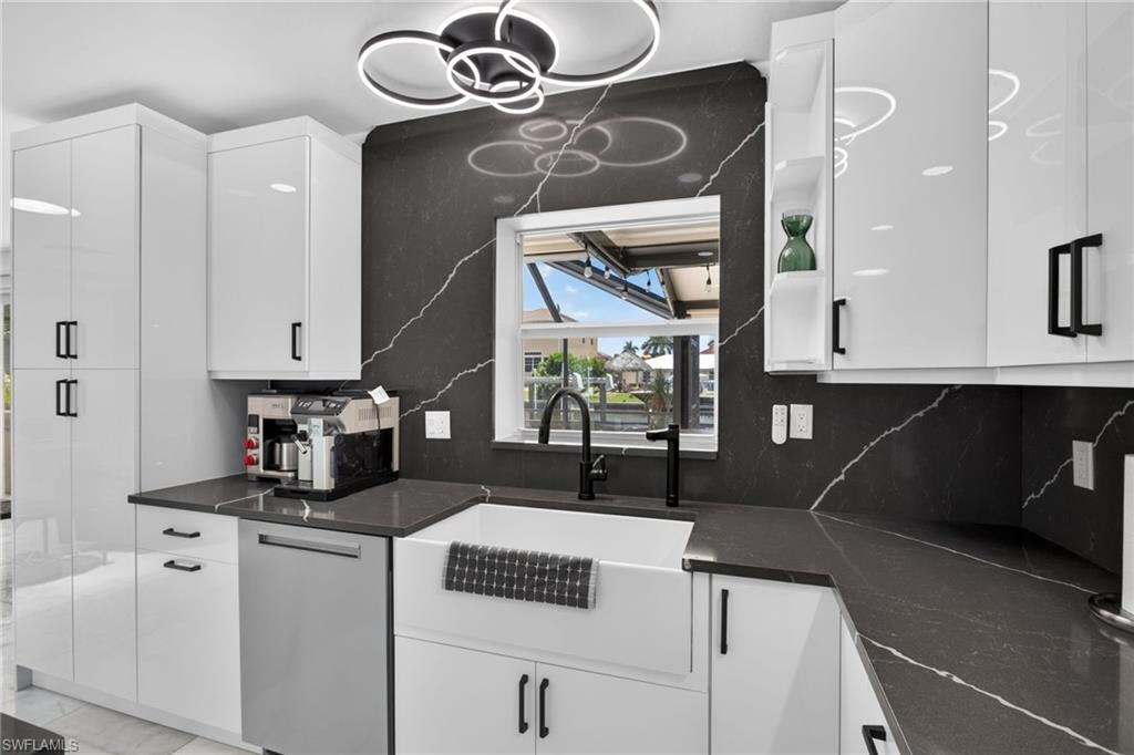 Soft close cabinetry, custom lighting/plumbing fixtures. Large Farmhouse Sink.
