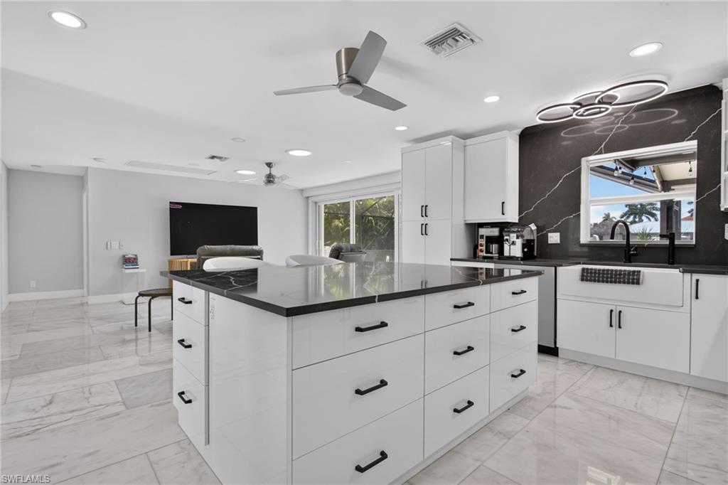 Kitchen opens up to the Great Room. Marble tile throughout the home.