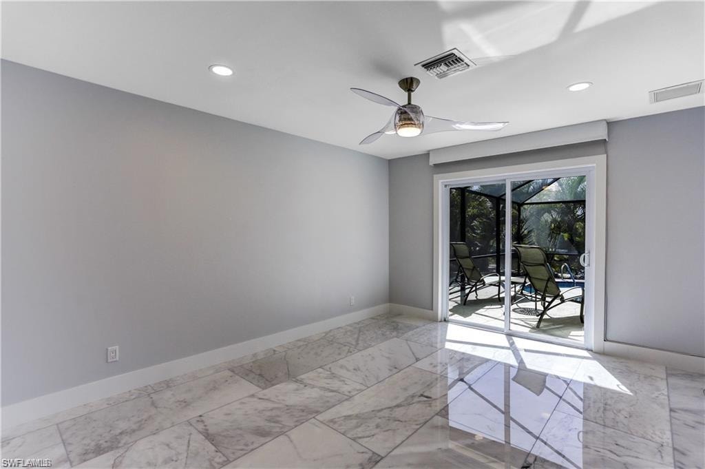 Sliders out to the lanai from Primary Bedroom. Pfiefer/Somfy electric shades.