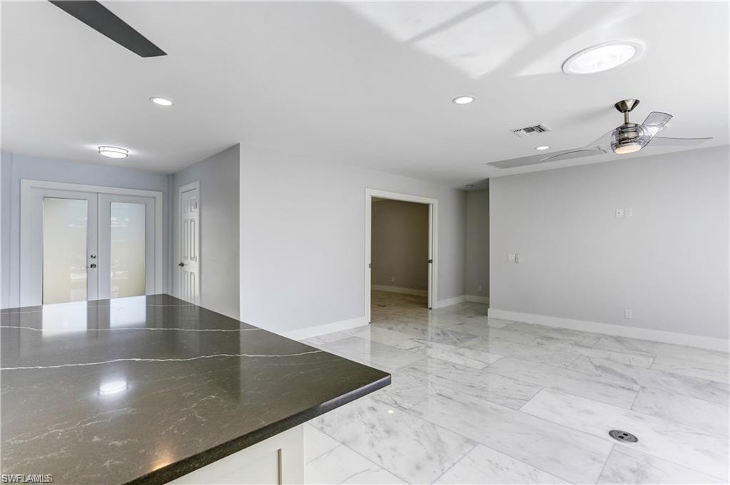 Kitchen opens up to the Great Room, Sliders out to lanai from Great Room.