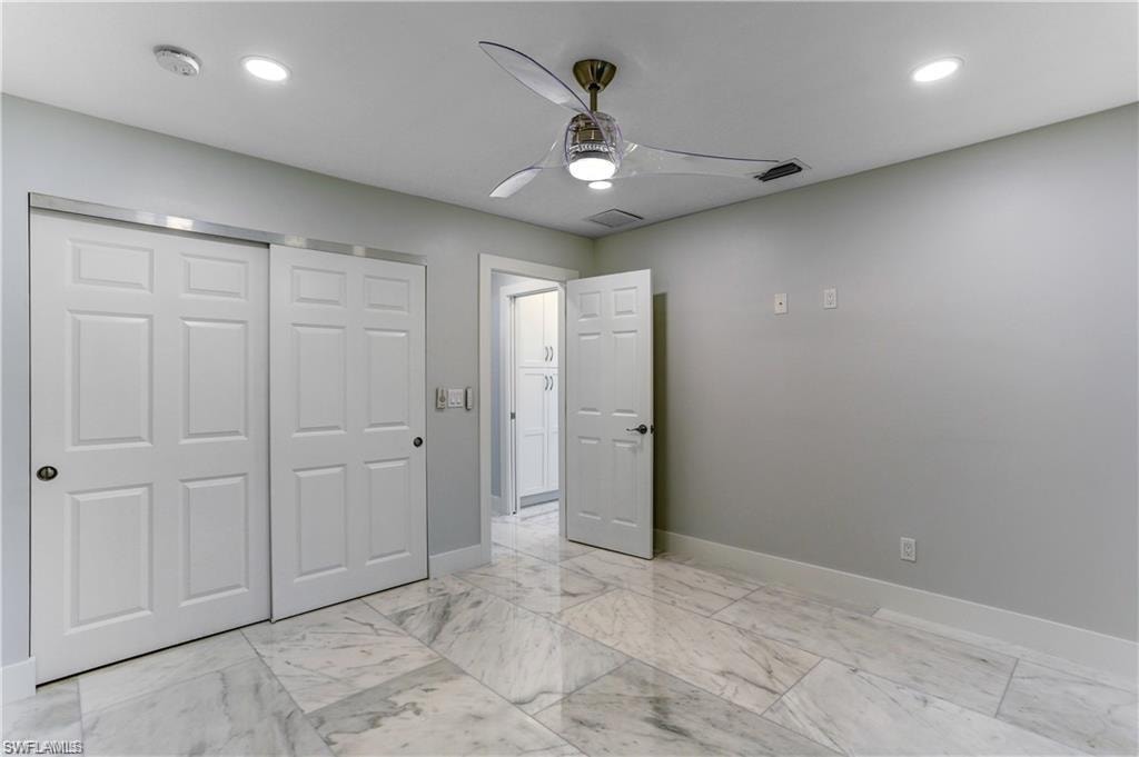 Back guest bedroom with large closet.