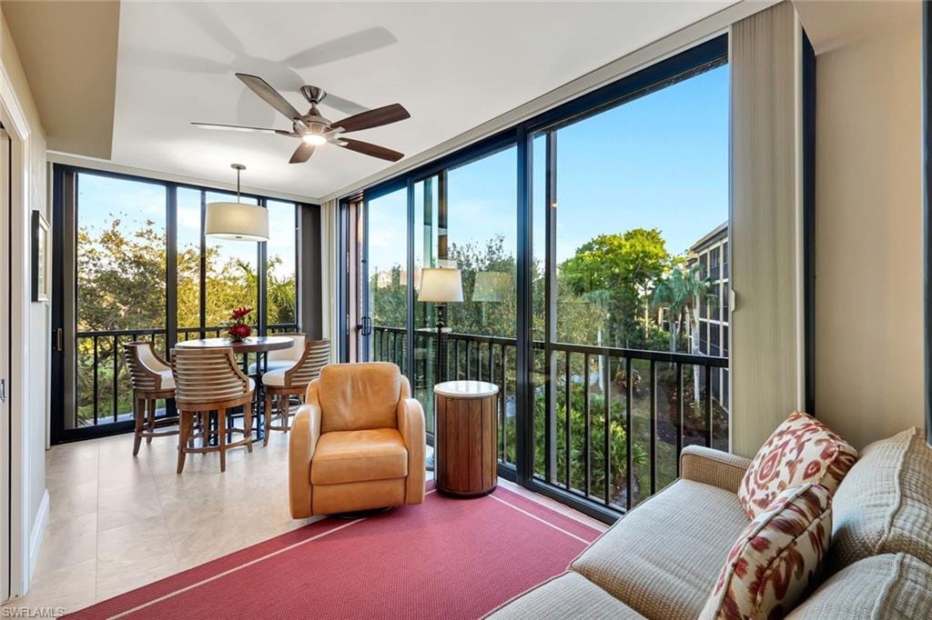 Impact glass enclosed den with sleeper sofa and dining area