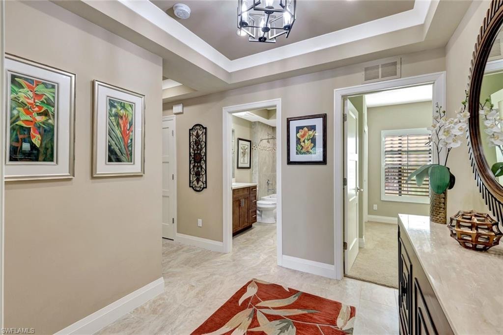 spacious hall with three adjacent bedroom suites.