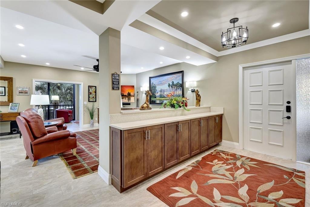 Front entry to this totally renovated Pelican Bay condo