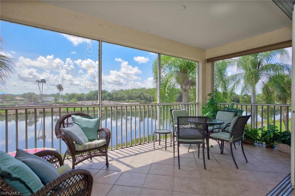 Screened-in outdoor living space with tile flooring