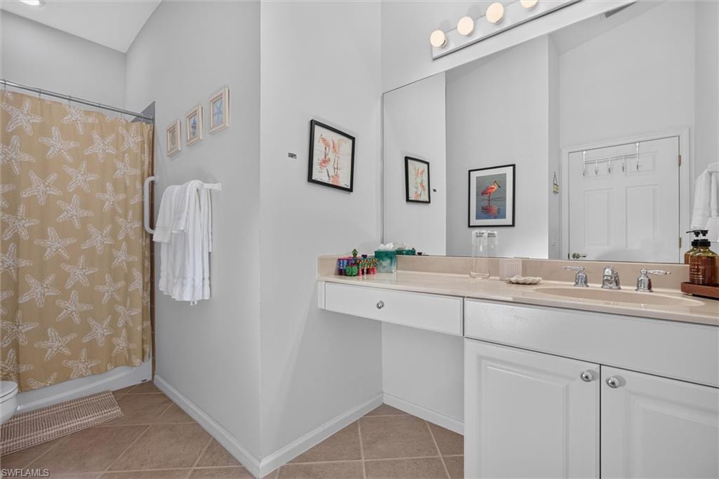 Dual vanity with an integrated sink and light-toned countertop