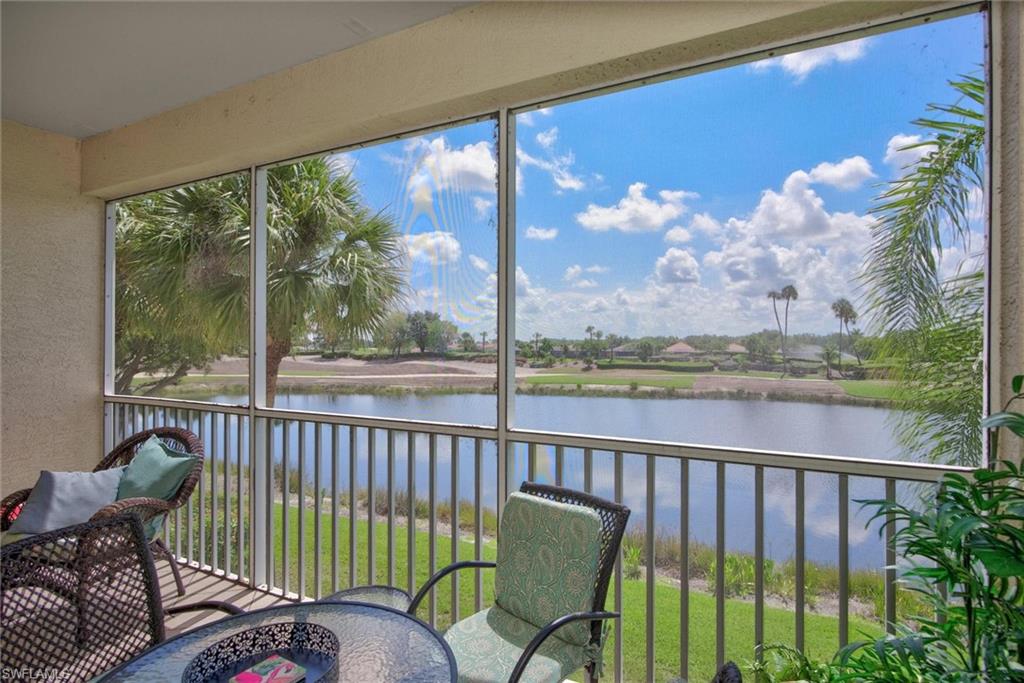 Screened balcony featuring a water-facing orientation and distant golf course views