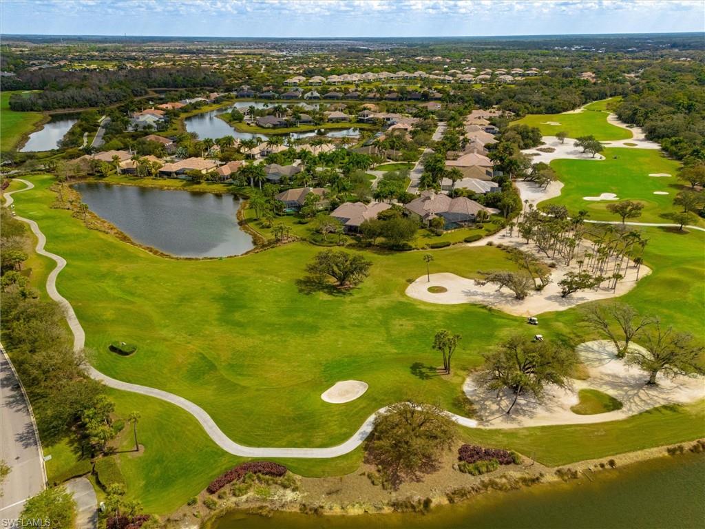 Expansive golf course with manicured greens and multiple sand traps
