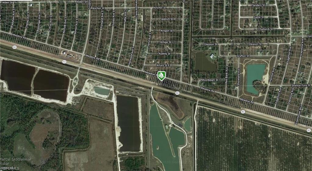 Satellite Imagery. Displaying a geographic area with residential grids, water bodies, and agricultural land