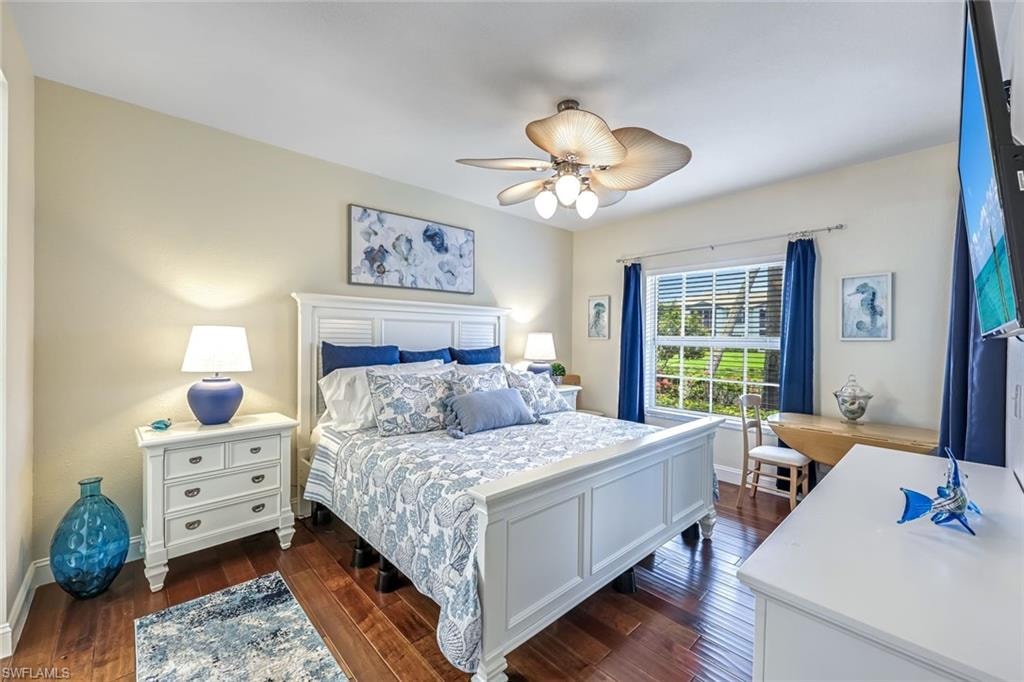 Bedroom featuring dark wood-type flooring and ceiling fan