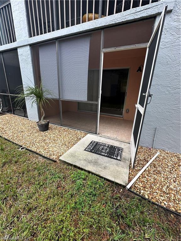 Ground-level screened patio with concrete flooring