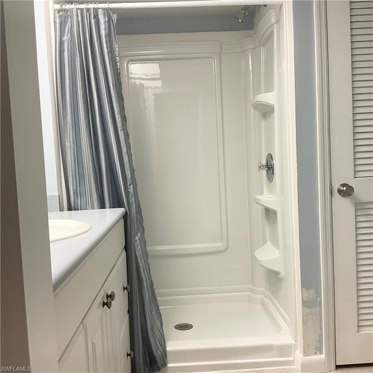 Guest bathroom with vanity and shower