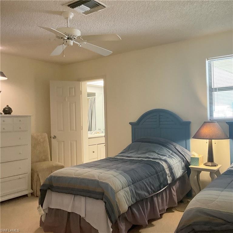 Carpeted guest bedroom  with en-suite