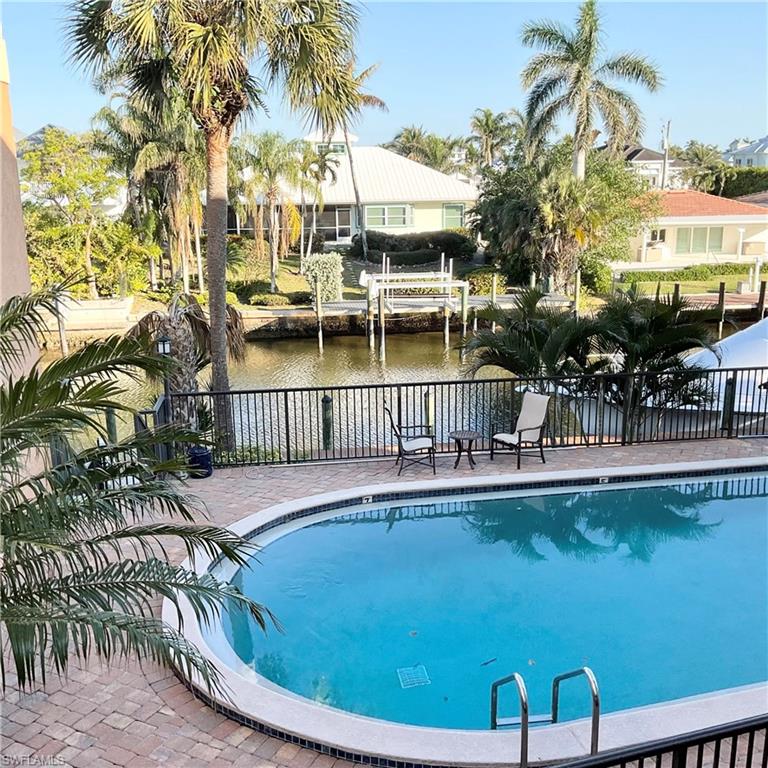 View of swimming pool with a water view