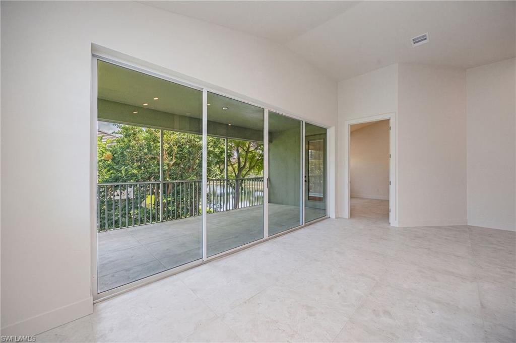Bright eat-in kitchen with the lanai just beyond, creating a seamless indoor-outdoor living space