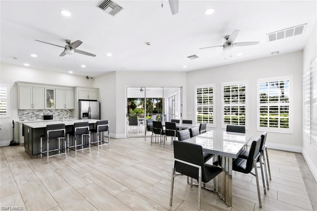 Second social room with refrigerator, oven and sink