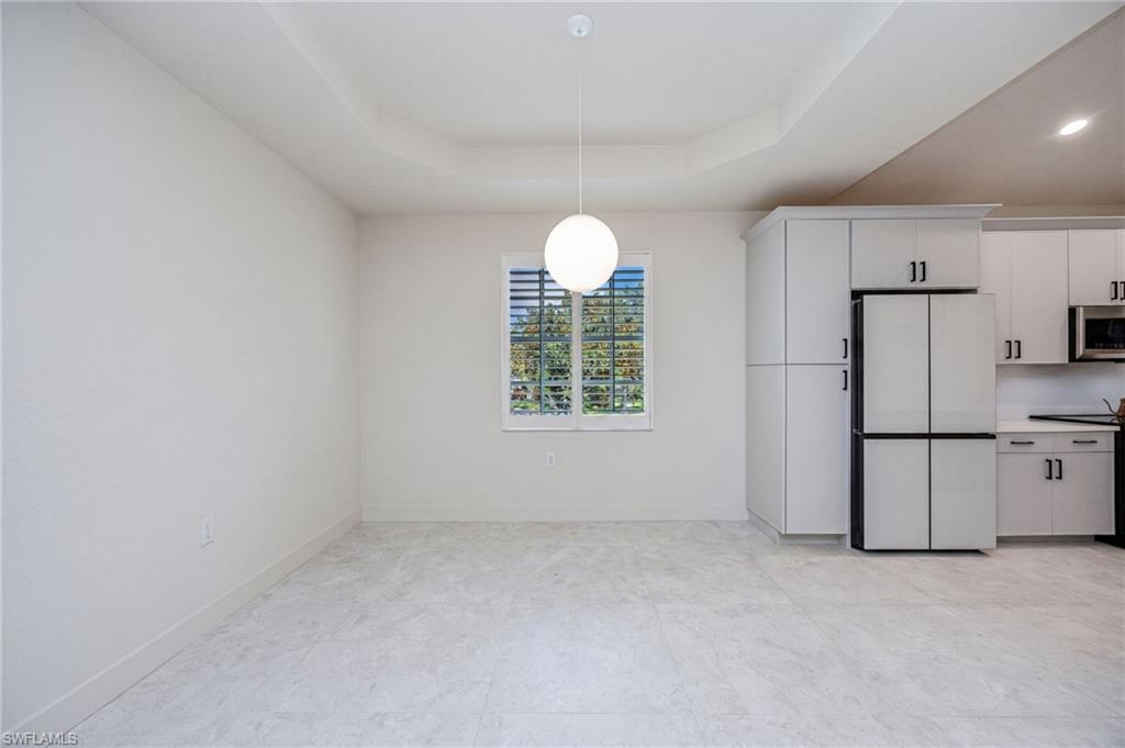 Spacious dining area conveniently located off the kitchen, creating the perfect setting for memorable gatherings with family and friends