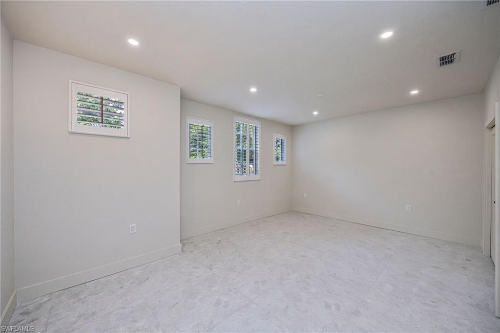 Unfurnished third bedroom highlighting its impressive size, natural light, and design potential