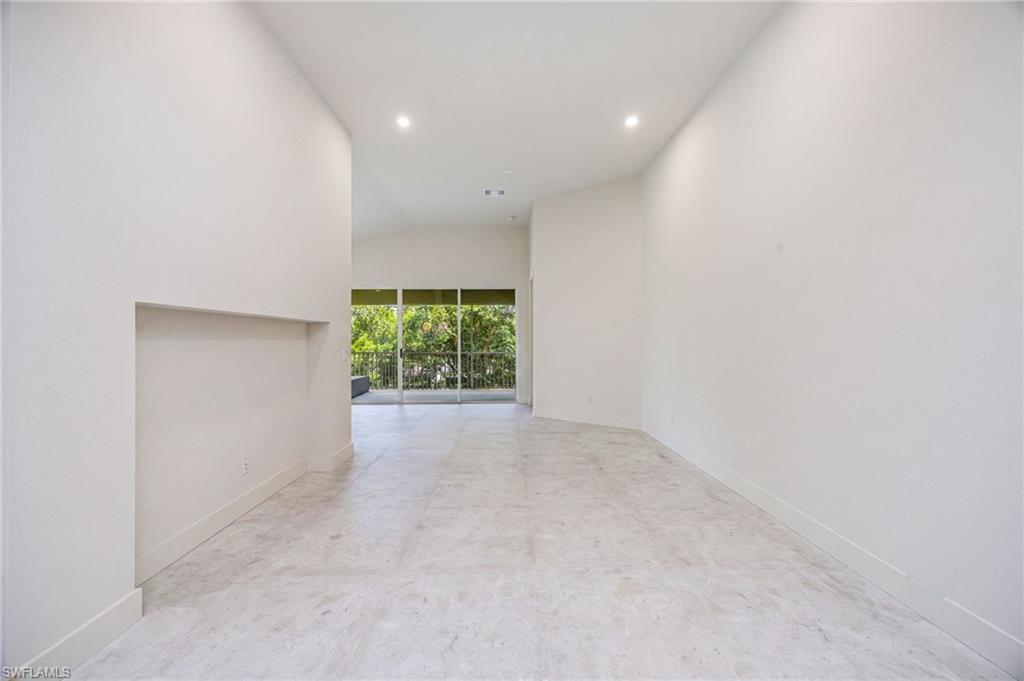 Spacious living room with 32" x 32" porcelain tile throughout the home