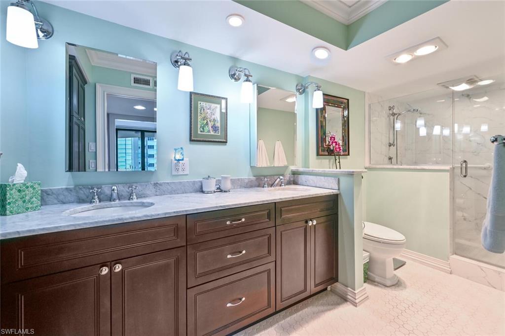 Marble shower, heat lamps & dual sinks