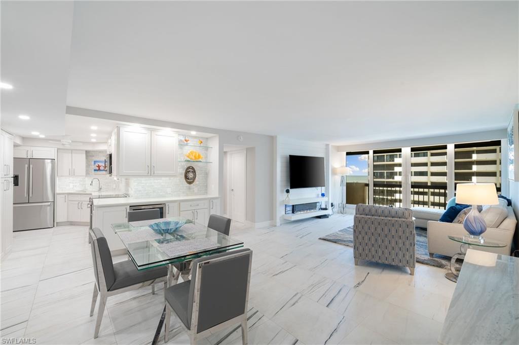 Dining area with light tile patterned floors and sink